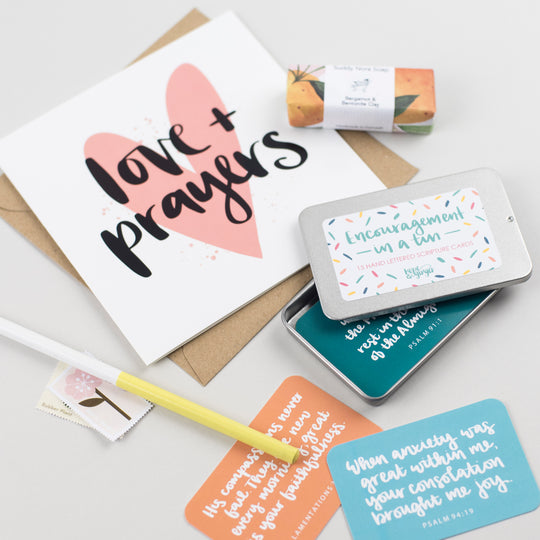 Thinking of you box with love & prayers card, divine chocolate, be still & know notebook, soap & encouragements in a tin