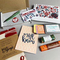 Red & green Scandinavian design festive gift box, tin of encouragements, journal, tea towel, pen, chocolate & soap
