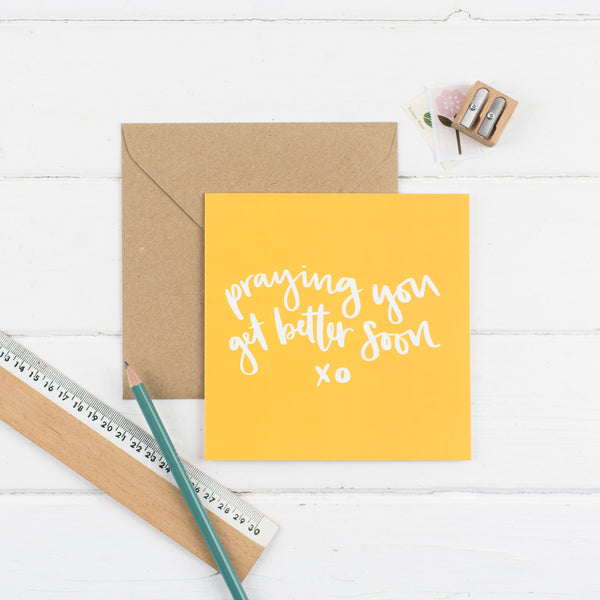 Praying you get better soon square greeting card - hand-lettered in white on a bright yellow background with kraft envelope