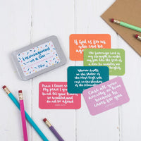 15 brightly coloured hand lettered scripture cards with encouraging scriptures presented in a slide-top tin