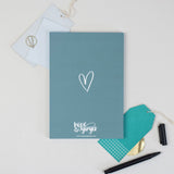 Back cover of the hand lettered grey/blue notebook with hand drawn heart illustration on the inside cover - Luke 1:45