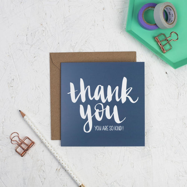 Hand lettered thank you square greeting card - white lettering on a dark blue card
