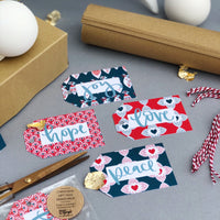 Hope, peace, love and joy red and blue Scandinavian designed gift tags with red and white twine