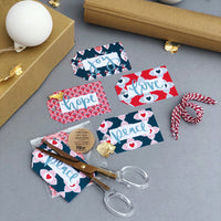 Mixed packs of Christmas gift tags. Designed and printed in the UK