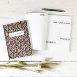 burgundy foliage design hand lettered notebook with yes and amen on the front with lines and space for drawing 