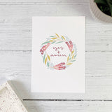 beautiful floral wreath print with the  hand lettered phrase 'yes and amen' in green, blue, pink and burgundy